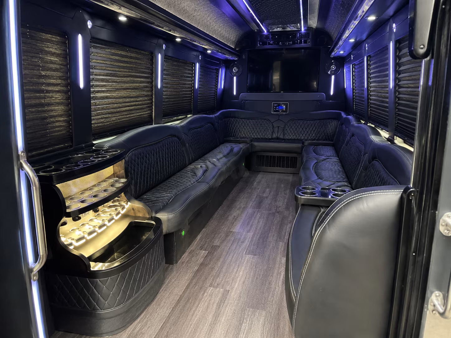 Wedding guests seated inside a party bus serving Fort Lauderdale